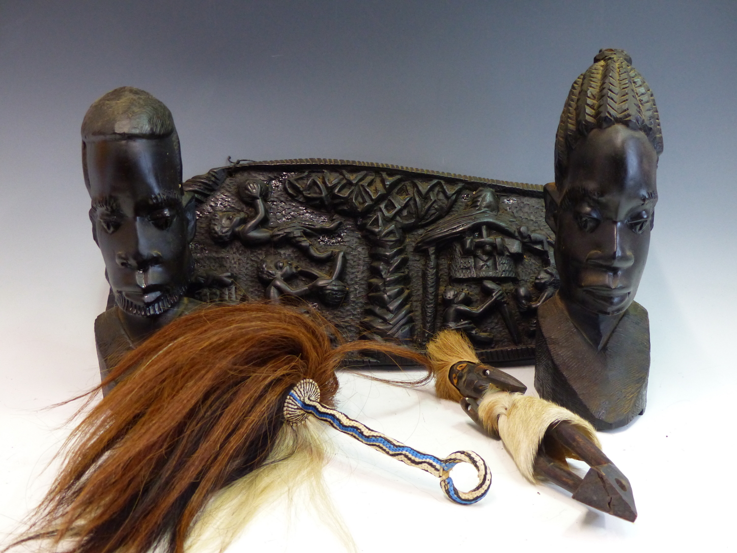 TWO AFRICAN HARDWOOD STANDING FIGURES, A PAIR OF HEADS, A RELIEF CARVED PLAQUE, A TABLE LAMP PIERCED - Image 3 of 3