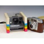 A POLAROID LAND CAMERA "THE BUTTON" IN ORIGINAL PACKAGING WITH MANUAL. TOGETHER WITH AN AGFA SILETTE