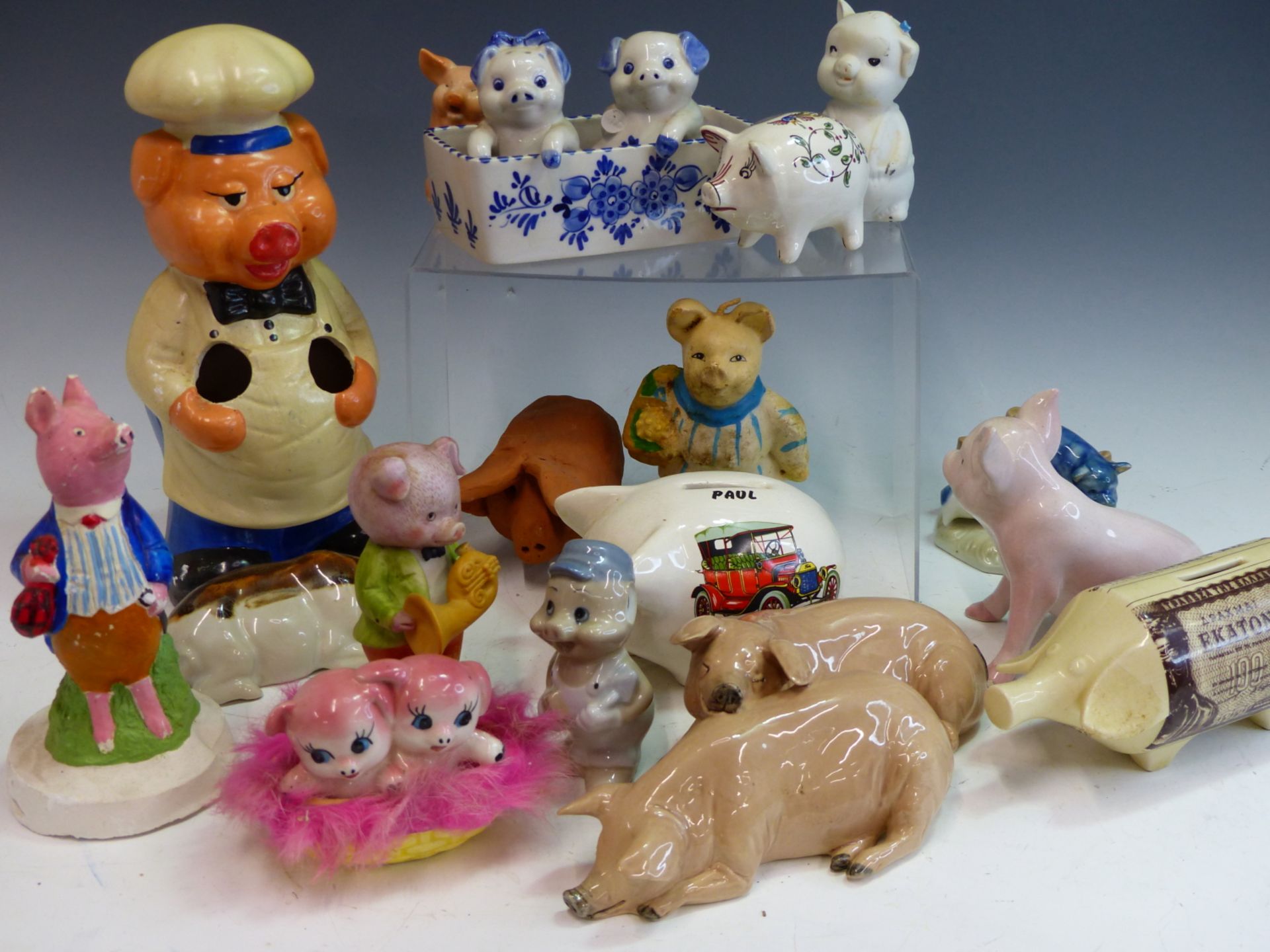 AN EXTENSIVE COLLECTION OF VINTAGE PIG ORNAMENTS INCLUDING MONEY BANKS.