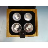 A 1976 MONTREAL OLYMPICS SILVER COMMEMORATIVE CANADIAN COIN SET BY COJO TO INCLUDE 2 X $10 & 2 X $