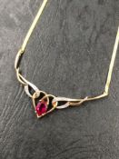 A HALLMARKED 9ct GOLD RUBY AND DIAMOND NECKLACE. THE OVAL CUT RUBY MEASUREMENTS 7.0 X 5.0 D 3.4mm.