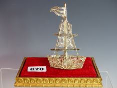 AN EASTERN SILVER FILIGREE MODEL OF A SAILING VESSEL. NO ASSAY MARKS ASSESSED AS 930 SILVER. 35.