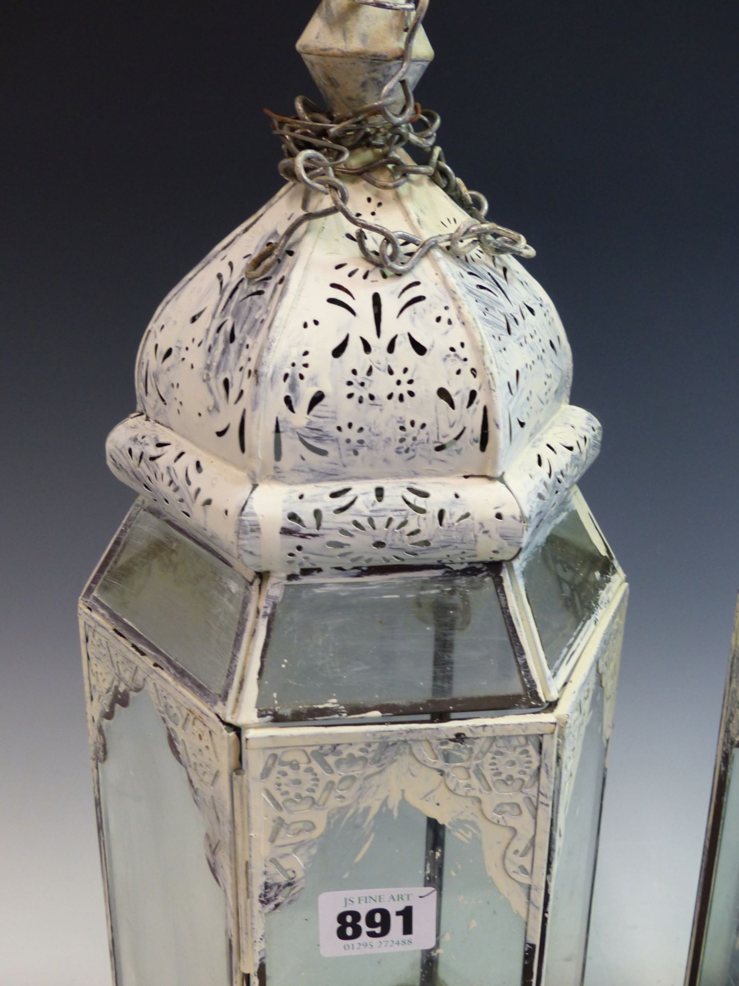 A PAIR OF PAINTED HEXAGONAL PIERCED METAL AND GLASS HANGING CANDLE LANTERNS. - Image 3 of 4