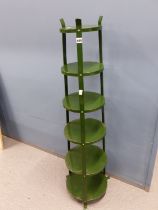 A SIX TIER GREEN PAINTED IRON POT STAND.