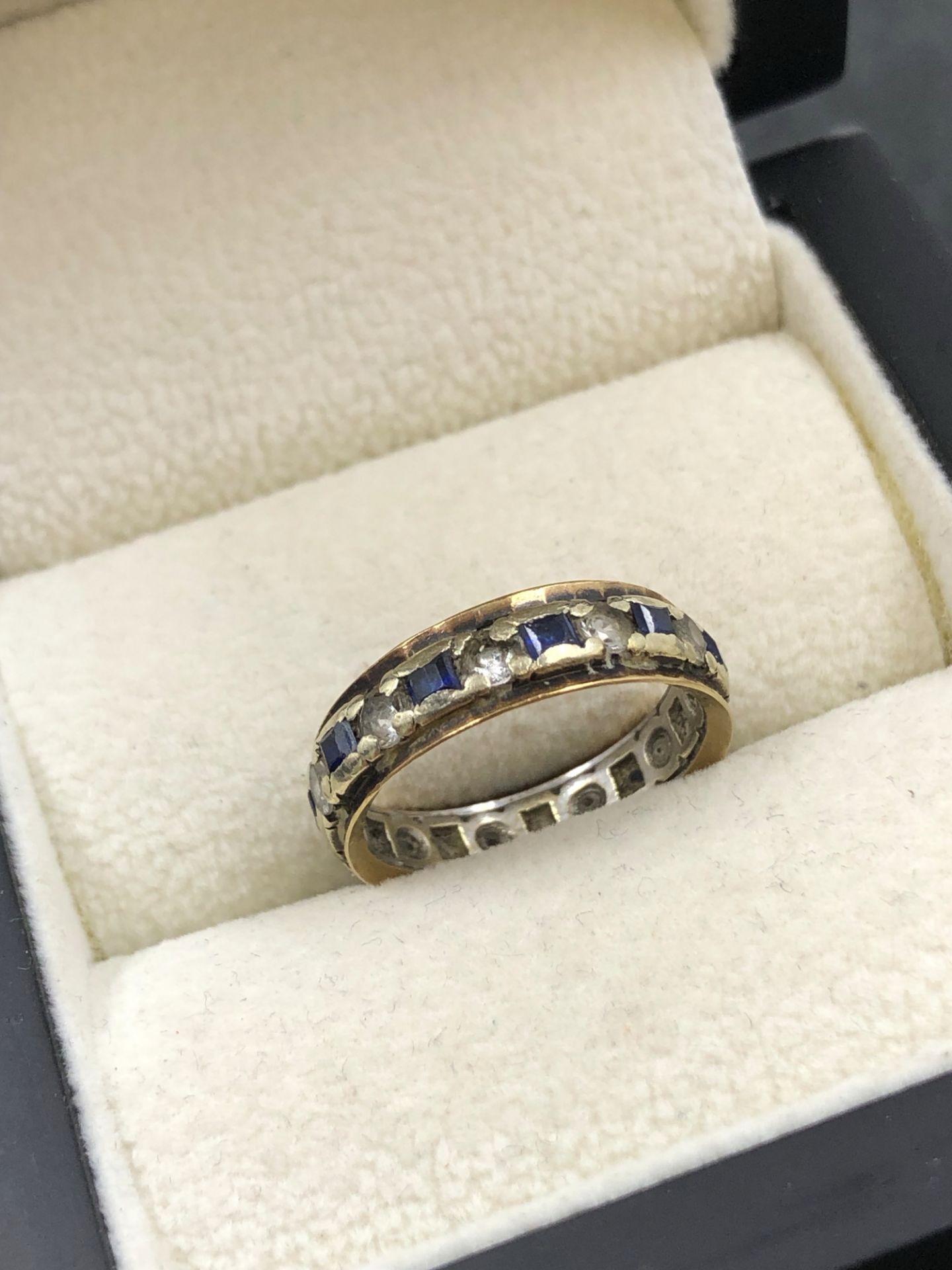 A VINTAGE STONE SET FULL ETERNITY RING. NO ASSAY MARKS ASSESSED AS 9ct GOLD. FINGER SIZE L. 2. - Image 2 of 2