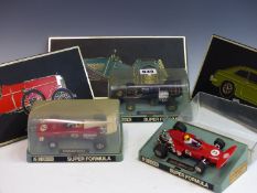 THREE VINTAGE SCALEXTRIC RACING CARS IN ORIGINAL DISPLAY BOXES. TOGETHER WITH THREE UNIPART