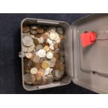 A CASH BOX CONTANING VARIOUS WORLD COINS.
