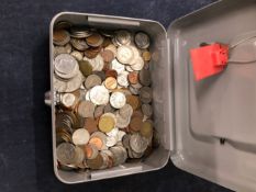 A CASH BOX CONTANING VARIOUS WORLD COINS.