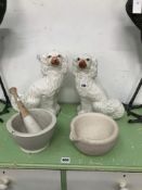 A PAIR OF STAFFORDSHIRE SPANIELS TOGETHER WITH TWO MORTARS AND A PESTLE