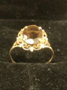 A 9ct GOLD HALLMARKED SMOKEY QUARTZ RING. FINGER SIZE P 1/2. WEIGHT 1.73grms