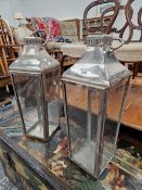 A PAIR OF STAINLESS STEEL CANDLE LANTERNS