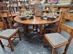 A BESPOKE LARGE BURR ELM CIRCULAR DINING TABLE WITH EIGHT DINING CHAIRS
