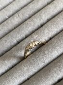A VINTAGE THREE STONE DIAMOND RING. UNHALLMARKED, ASSESSED AS 22ct GOLD SHANK AND A 18ct WHITE