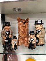 FOUR DOULTON WINSTON CHURCHILL JUGS AND A BESWICK TERRIER FIGURE.