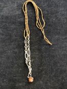 A LINKS OF LONDON SILVER AND WOVEN CHAIN LONG NECKLACE WITH SPINNING HARDSTONE BALL PENDANT.