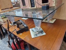 A GLASS AND ALLOY RETRO COFFEE TABLE.