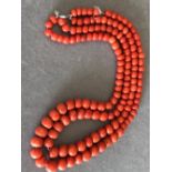 A DOUBLE ROW OF VINTAGE GRADUATED CORAL BEADS. SMALLEST TO LARGEST 6.2mm - 10.5mm. GROSS WEIGHT 92.