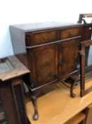 A WALNUT BEDSIDE CABINET