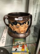 A BRETBY BRONZED TWO HANDLED PLANTER WITH JAPANESE FIGURES IN RELIEF