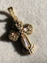 A STONE SET CROSS. THE CROSS STAMPED 585 ASSESSED AS 14ct GOLD. WEIGHT 8.24grms.