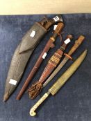 A VINTAGE KUKRI AND 4 FURTHER EASTERN KNIVES.