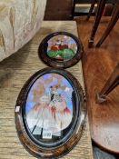 A PAIR OF REVERSE PAINTED AND BUTTERFLY WING OVAL PICTURES