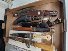 A COLLECTION OF ORNAMENTAL SWORDS AND KNIVES.