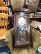 A ANTIQUE CASED WALL CLOCK