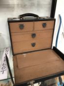 A LEATHER CASED FOUR DRAWER DOCTORS CASE