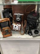 A LANCASTER 1/4 PLATE MAHOGANY AND BRASS CAMERA AND VARIOUS OTHER VINTAGE CAMERAS.
