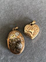 TWO 9ct GOLD PORTRAIT LOCKETS. ONE WITH FLORAL ENGRAVING THE OTHER HEART SHAPE WITH A CELTIC DESIGN.