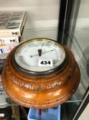 AN ANTIQUE ANEROID BAROMETER BY NEWTON AND CO.