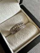 AN 18ct HALLMARKED 18ct WHITE GOLD AND DIAMOND SET OPEN WORK RING. APPROX. STATED WEIGHT 0.25cts
