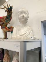 A VINTAGE PLASTER BUST OF A CHILD.