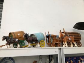 THREE POTTERY CART HORSES TOGETHER WITH FOUR CARAVAN CARTS