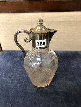 A CUT GLASS CLARET JUG WITH SILVER PLATED MOUNTS BY MAPPIN AND WEBB.