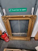 A LARGE VICTORIAN GILT PICTURE FRAME.