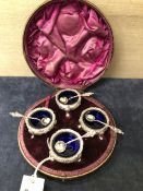 A CASED SET OF FOUR SILVER TRIPOD TUB SALTS AND SPOONS LONDON 1887
