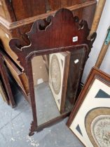 AN ANTIQUE FRET FRAMED WALL MIRROR