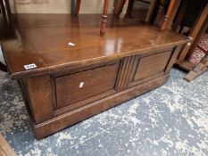 AN ANTIQUE STYLE HARDWOOD OTTOMAN COFFEE TABLE