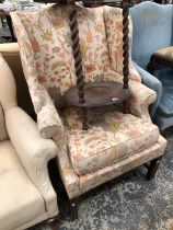 A WING BACK ARMCHAIR