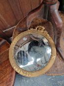 A GILT FRAMED CONVEX MIRROR