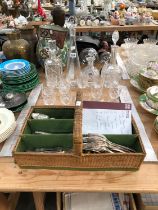 A CUTLERY BASKET OF KINGS PATTERN ELECTROPLATE CUTLERY, DRINKING GLASS AND FOUR DECANTERS