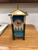 A MODERN ARTS AND CRAFTS STYLE CLOCK IN THE MANNER OF VOYSEY.