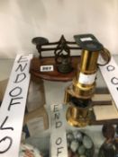 A STUDENTS MICROSCOPE TOGETHER WITH A SET OF LETTER SCALES WITH WEIGHTS