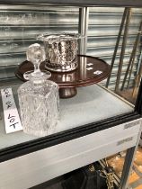 A MAHOGANY LAZY SUSAN, AN ELECTROPLATE WINE COASTER AND A SPIRIT DECANTER