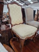 A PAIR OF FRENCH CARVED SHOW FRAME SALON CHAIRS