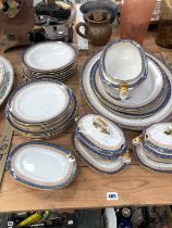 A ROYAL WORCESTER PART DINNER SERVICE WITH BLUE AND GILT DECORATION.