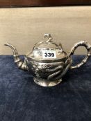 A CHINESE SILVER TEAPOT WITH DRAGON DECORATION. 493 gms.