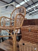 A BAMBOO CHAIR AND TWO WICKER HAMPERS
